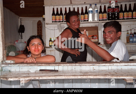 Three people working in small family run bar in Manaus, Amazon, Brazil Stock Photo