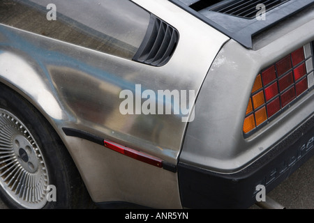 Delorean sports car famous for its stainless steel and political intrigue now derelict in a lot in New Zealand Stock Photo