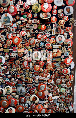 cultural revolution era badges for sale in Dongtai antiques Market, Shanghai, China Stock Photo