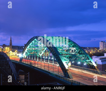 Traffic crosses the Wearmouth Bridge over the River Wear at night, in Sunderland Tyne & Wear Stock Photo