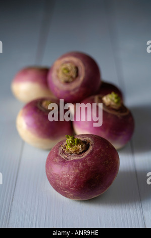 Turnips on blue wooden table Stock Photo