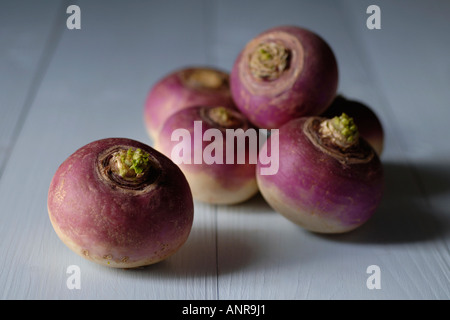 Turnips on blue wooden table Stock Photo