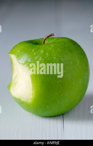 Granny Smith apple with bite taken out Stock Photo