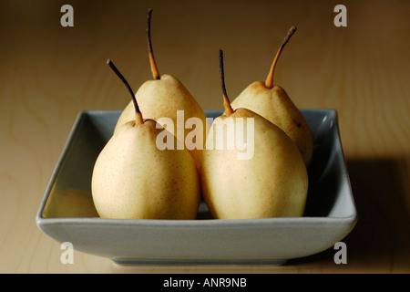 Nashi Asian or Sand Pears in square ceramic bowl on table Stock Photo