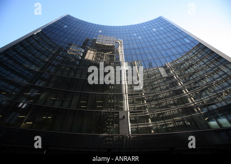 The Lloyd s building reflected in the windows of the Willis Building London England Stock Photo