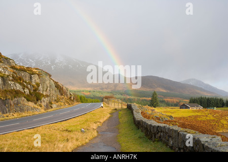 View at rainbow over A86 road from Loch Laggan Dam parking. Highlands ...