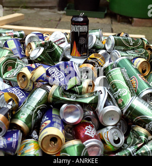 pile of empty beer cans waiting to be sorted into steel or aluminium.  Aluminium cans are then recycled. Stock Photo