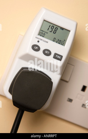 electronic device for measuring how much electricity / energy is consumed by electrical appliances Stock Photo