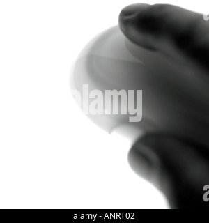 BLURRED MONO IMAGE OF A HAND USING A WIRELESS MOUSE Stock Photo