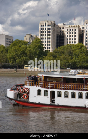 The paddle steamer the Elizabethan on the River Thames in London with the Victoria enbankment and the Adelphi Building visible i Stock Photo