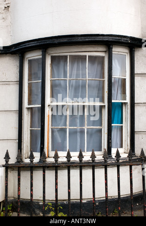 Distorted Regency bow window of Sandmarsh Cottage Aberystwyth built 1790, subject to subsidence due to its sandy foundations Stock Photo