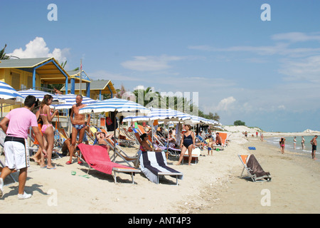 Holiday makers relaxing on the beach of the Adriatic coast of Le Marche ,Italy Stock Photo