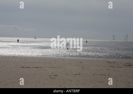 Anthony Gormley Another Place a series of figure sculptures on the beach at Crosby near Liverpool merseyside england Stock Photo