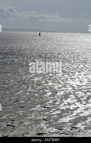 Anthony Gormley Another Place a series of figure sculptures on the beach at Crosby near Liverpool Merseyside England Stock Photo