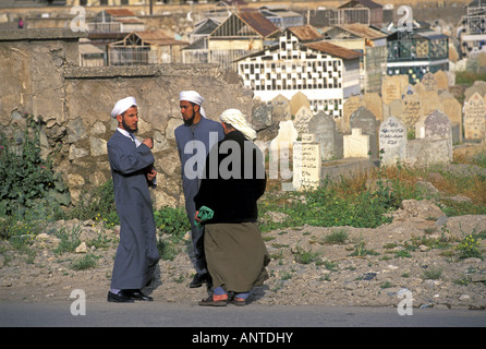 Iraqi relgious clerics visiting graveyard in Mosul, Iraq. Stock Photo