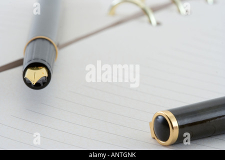 Expensive fountain pen on a notepad Stock Photo