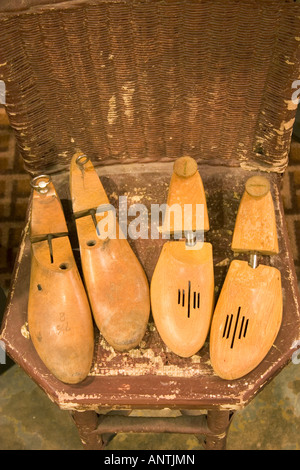 Antique shoe forms on a vintage wicker chair.