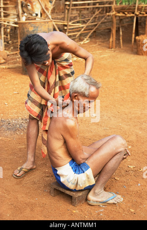 Tribal Villager Getting Haircut Stock Photo