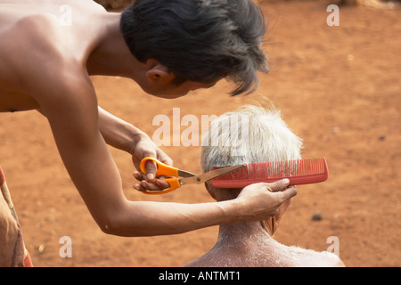 Tribal Villager Getting Haircut Stock Photo