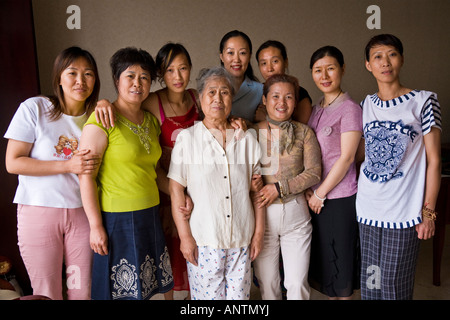 Group of nine asian oriental Chinese women standing facing camera JMH2945 Stock Photo