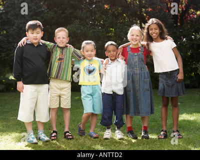 Group of 6 children looking at camera Stock Photo