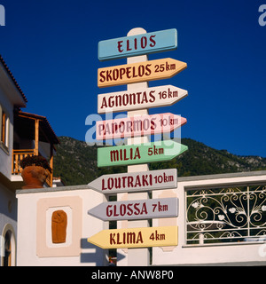 Signpost with arrows and wooden colorful small houses with Baltic ...
