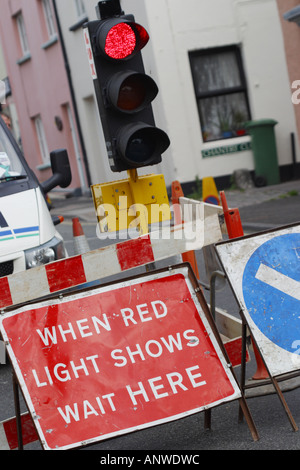 Red temporary traffic lights at road works Stock Photo - Alamy
