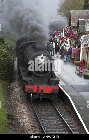 A steam Train pulls into Haworth Station on the preserved Keighley and Worth valley heritage Railway Haworth West Yorkshire Stock Photo