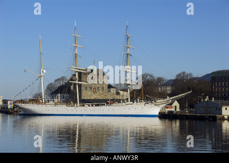 The famous sailship Statsraad Lemkuhl in Bergen harbour, Norway.  In the background is Haakonshallen, one of the best known and Stock Photo