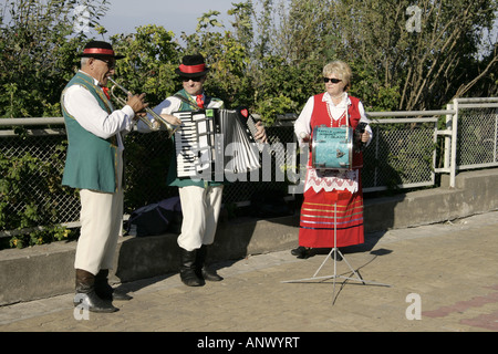 native street musicians in traditional costumes, Poland, Pomerania, Ustka Stock Photo