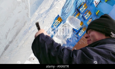 artist modelizing an ice block with a chisel Stock Photo - Alamy