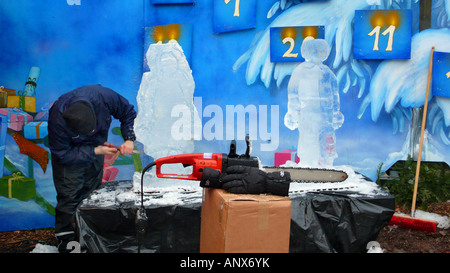 artist modelizing an ice block with a chisel Stock Photo - Alamy