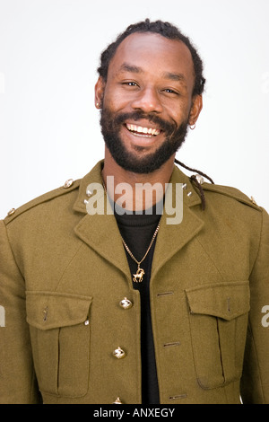 A Black man in a Army jacket isolated on a white background Stock Photo