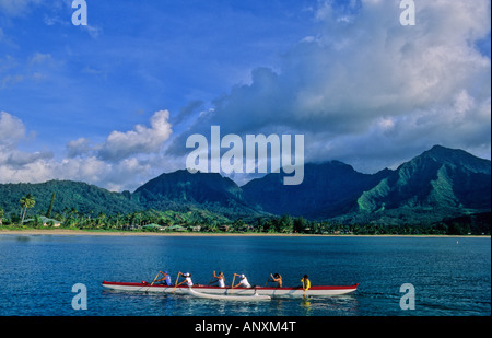 Outrigger canoe in Hanalei Bay on Kauai, seen from the Hanalei Pier Stock Photo