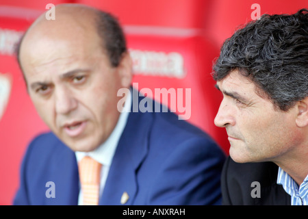 Jose Maria del Nido (left) and Juande Ramos (right), talking before the match. Stock Photo