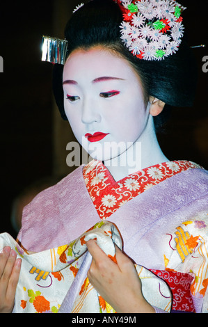 Japan, Honshu Island, Kyoto Prefecture, Kyoto City. Maiko (Trainee Geisha) entertainment at a formal dinner banquet. Stock Photo