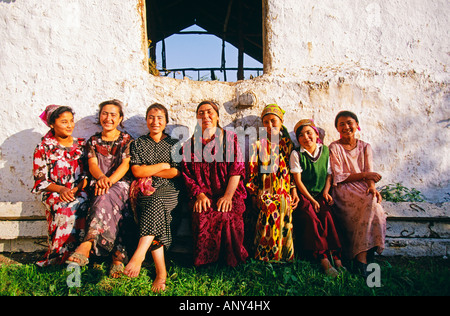 Happy Uzbek family with children in traditional Uzbek costumes on the ...