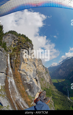 Switzerland, Bernese Oberland, Murren. A paraglider taking in the alpine views over Murren. Stock Photo
