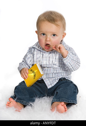 Young baby playing a dangerous game with matches Stock Photo