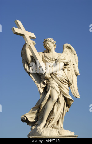 vertical view statue of Angel carrying cross near Castel Sant Angelo Rome Italy Stock Photo