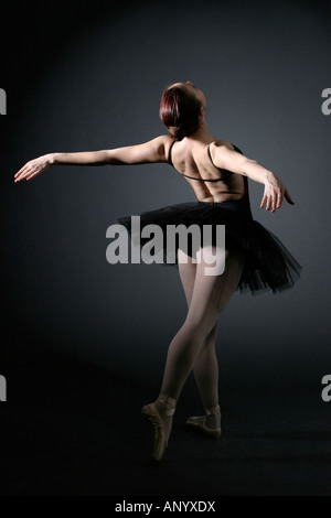 Ballerina in studio - rear view Stock Photo