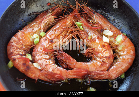 pan fried shell on prawns with garlic and chopped spring onion Stock Photo