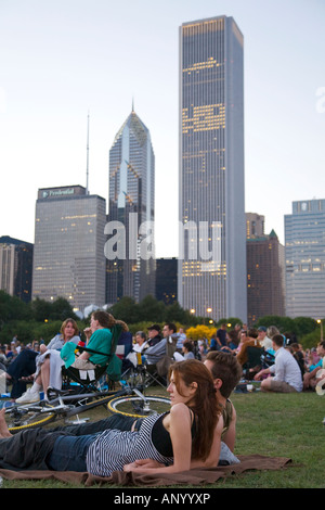 ILLINOIS Chicago Crowd of people sitting in Grant Park Petrillo outdoor stage for Jazz Festival, young couple sitting Stock Photo