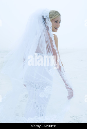 Bride looking over shoulder Stock Photo