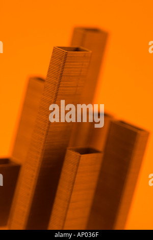 Staples in an office block formation Macro cityscape in orange  Stock Photo