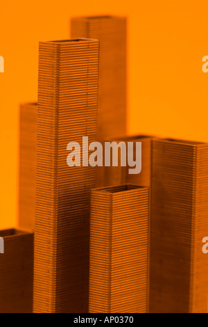 Staples in an office block formation Macro cityscape in orange  Stock Photo