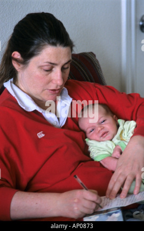 New mother working from home Stock Photo