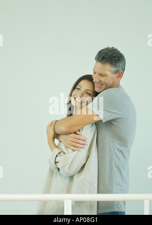 People Standing Behind Railing Man and woman standing behind railings, lower section Stock Photo - Alamy