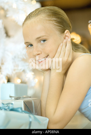 Girl next to presents Stock Photo