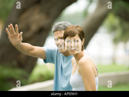 Mature couple, man waving Stock Photo